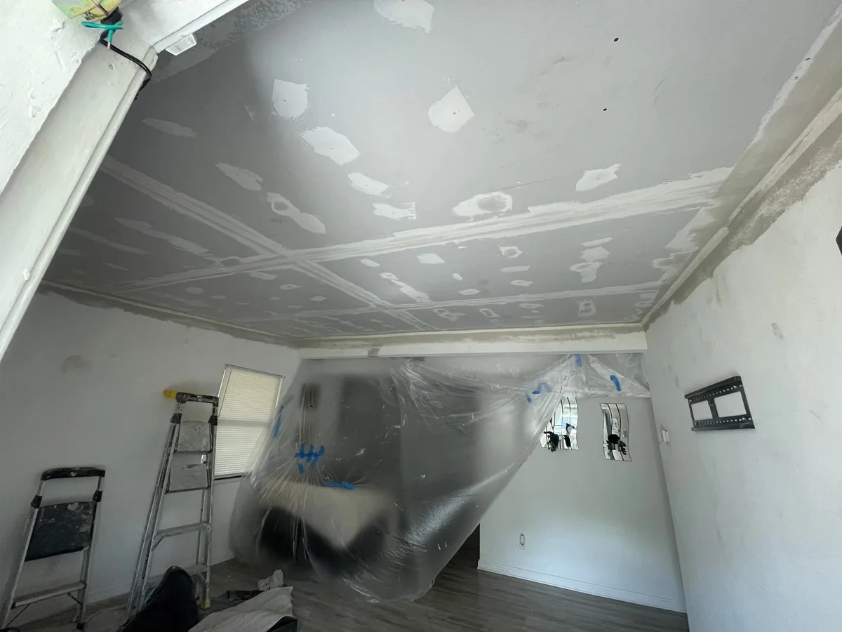 Ceiling patched and skimmed with the room protected