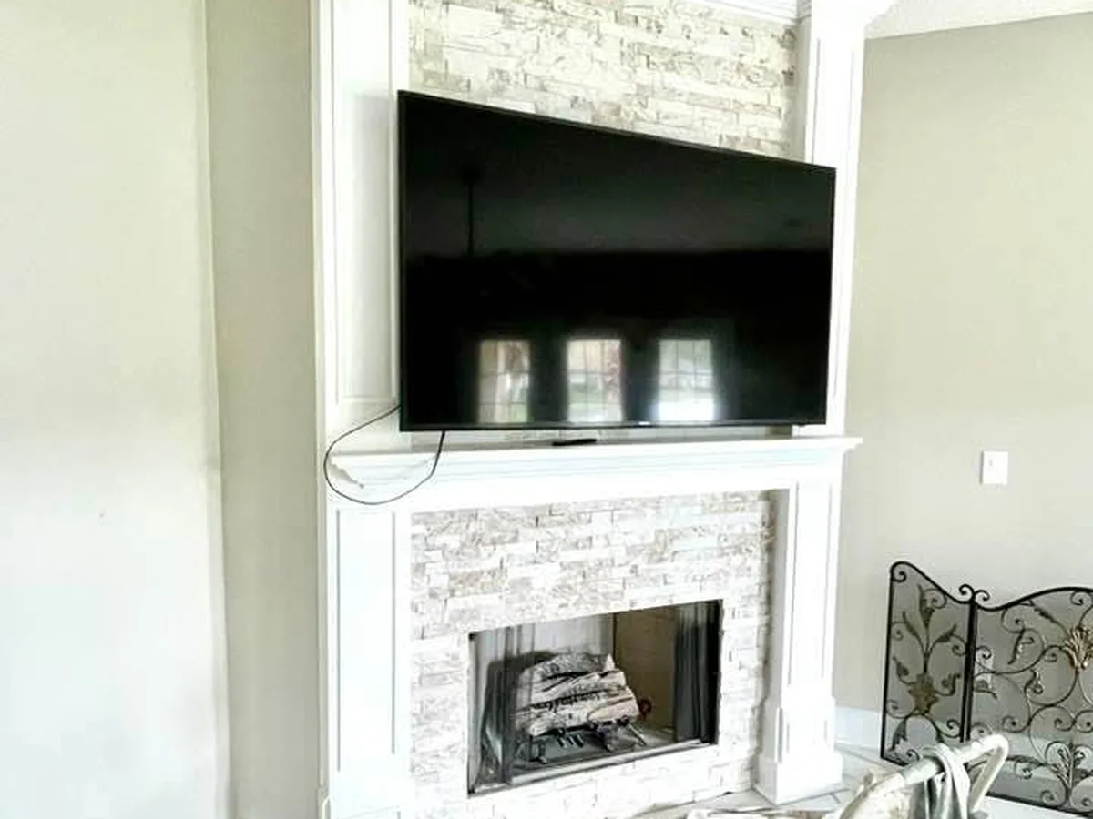 Fireplace wall painted and trimmed