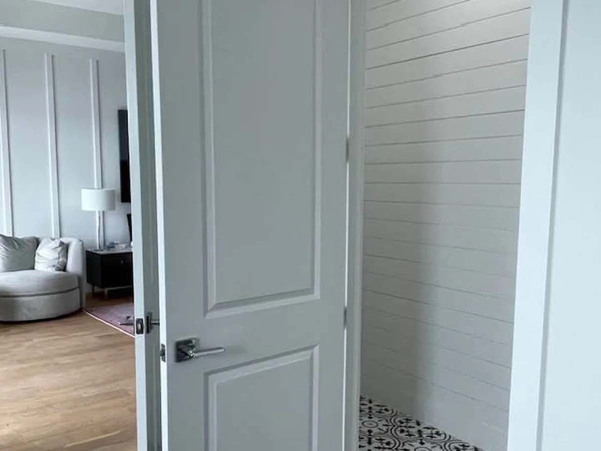Hallway doors and shiplap finished in white
